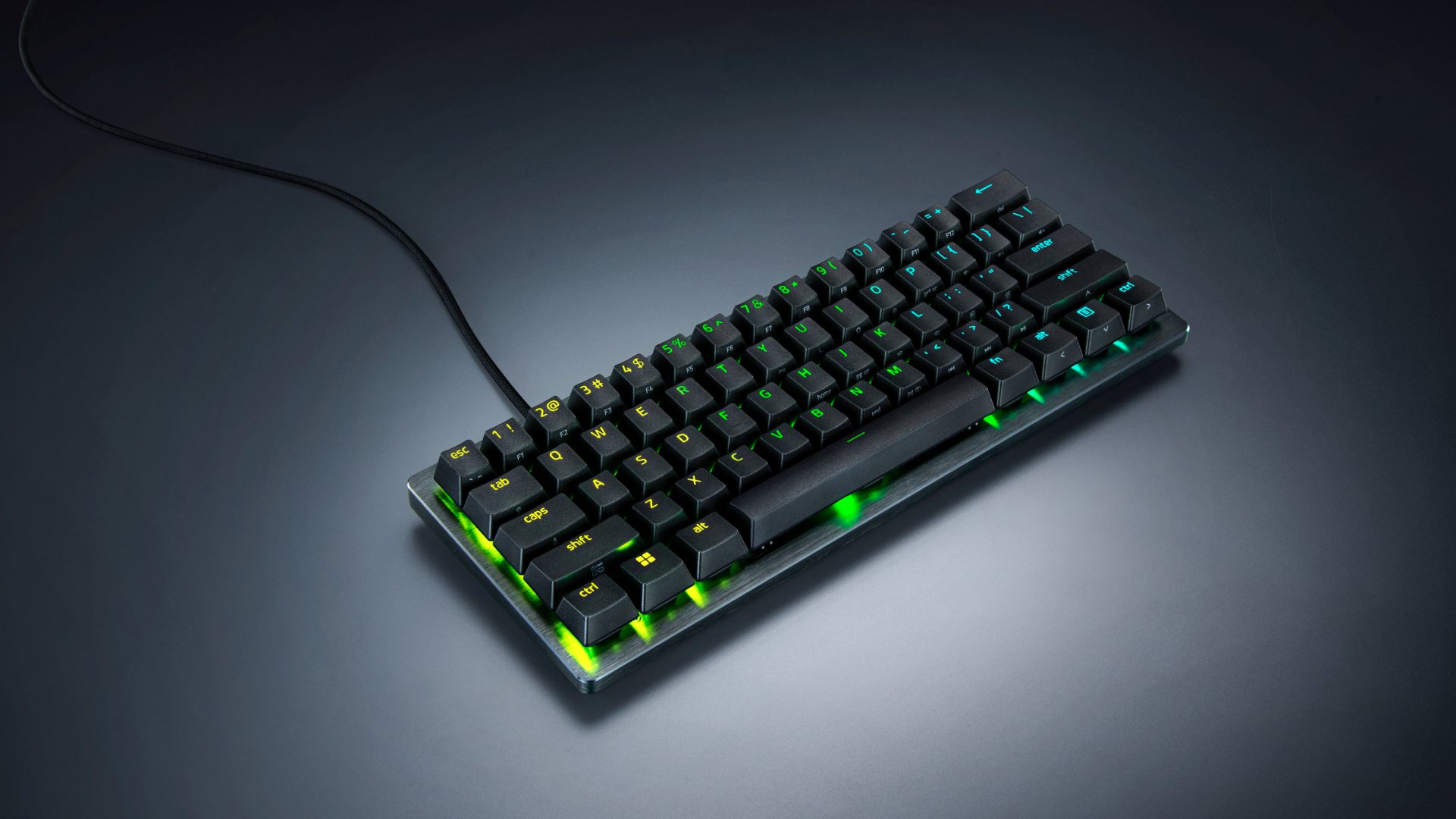 책상 위에 놓인 Razer Huntsman V3 Pro Mini 8KHz 60% 게이밍 키보드